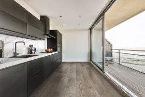 Amazing kitchen with black kitchen unit and coffee machine